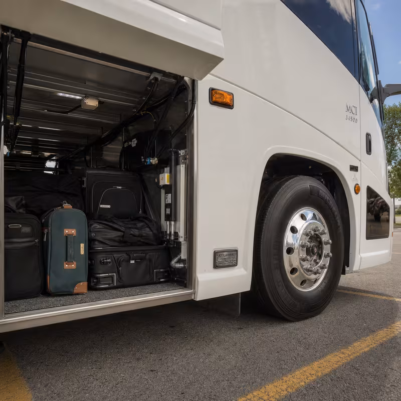 Party bus interior with wraparound leather seating and LED lighting in Tucson