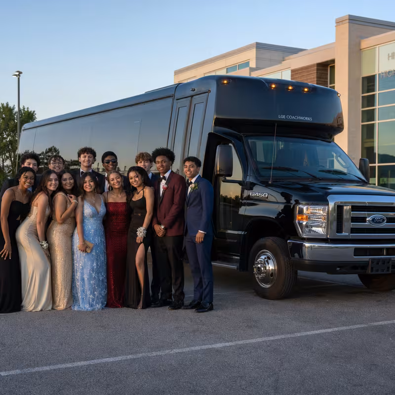 Group boarding a white charter bus for Prom & Homecoming Transportation transportation in Tucson