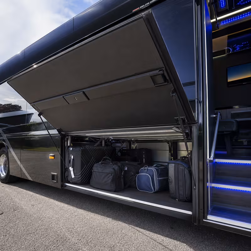 Party bus interior with wraparound leather seating and LED lighting in Tucson