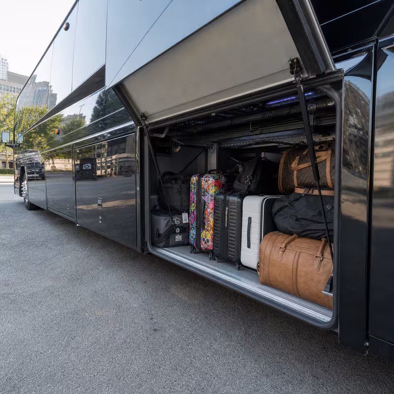 Party bus interior with wraparound leather seating and LED lighting in Tucson