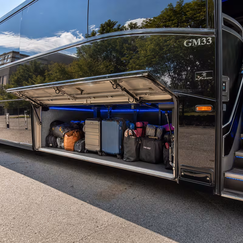Party bus interior with wraparound leather seating and LED lighting in Tucson