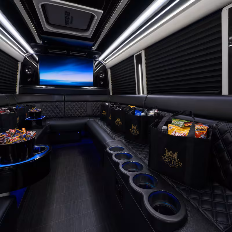 Party bus interior with wraparound leather seating and LED lighting in Tucson