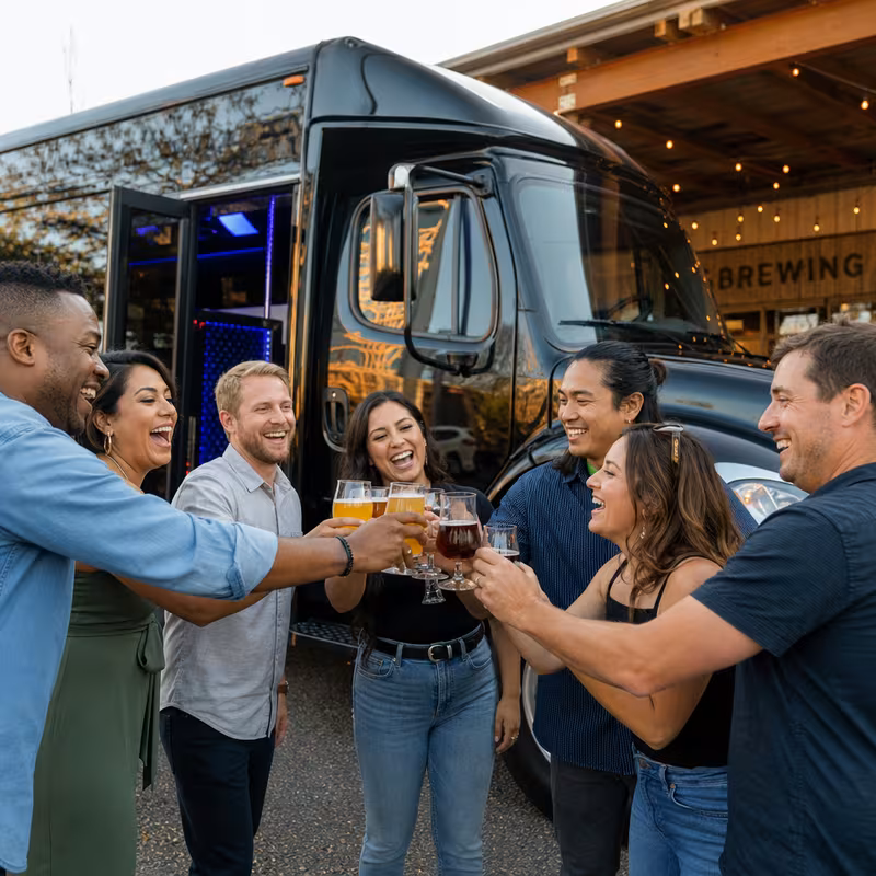 Passengers loading luggage while boarding an Tucson group shuttle